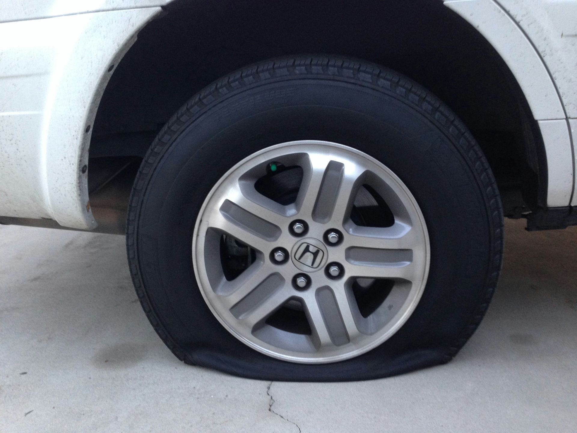 gray 5 spoke wheel with tire